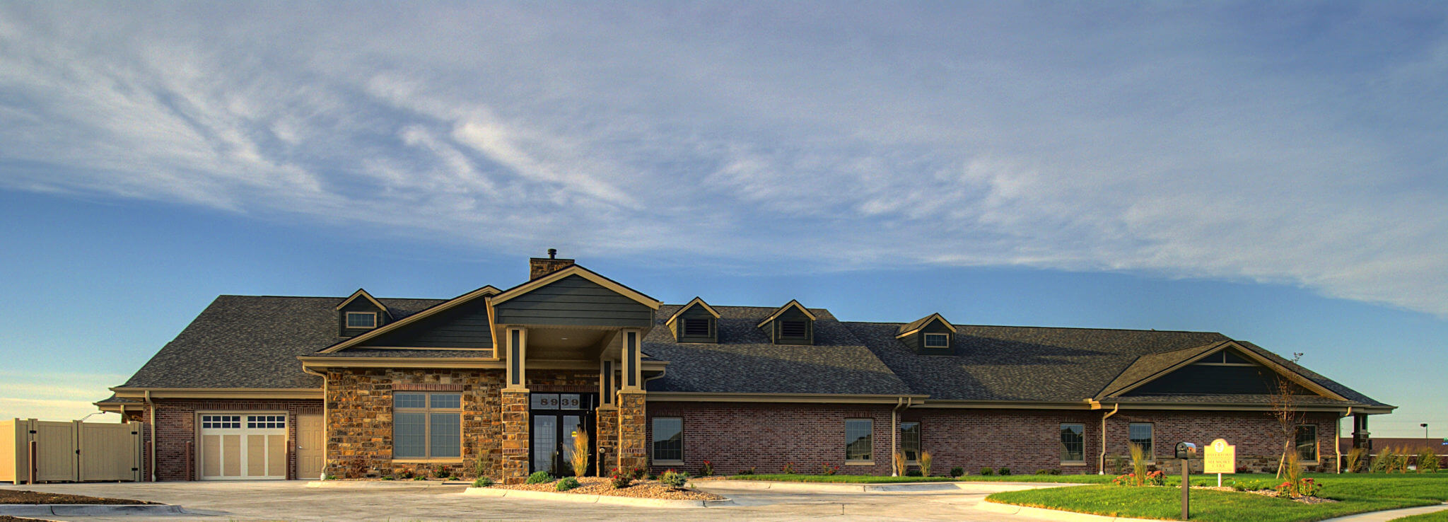The Waterford Wilderness Hills Memory Care Facility exterior at sunset