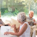 assisted living residents enjoying community space on a sunny day