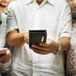 group of elderly people socializing with smartphones