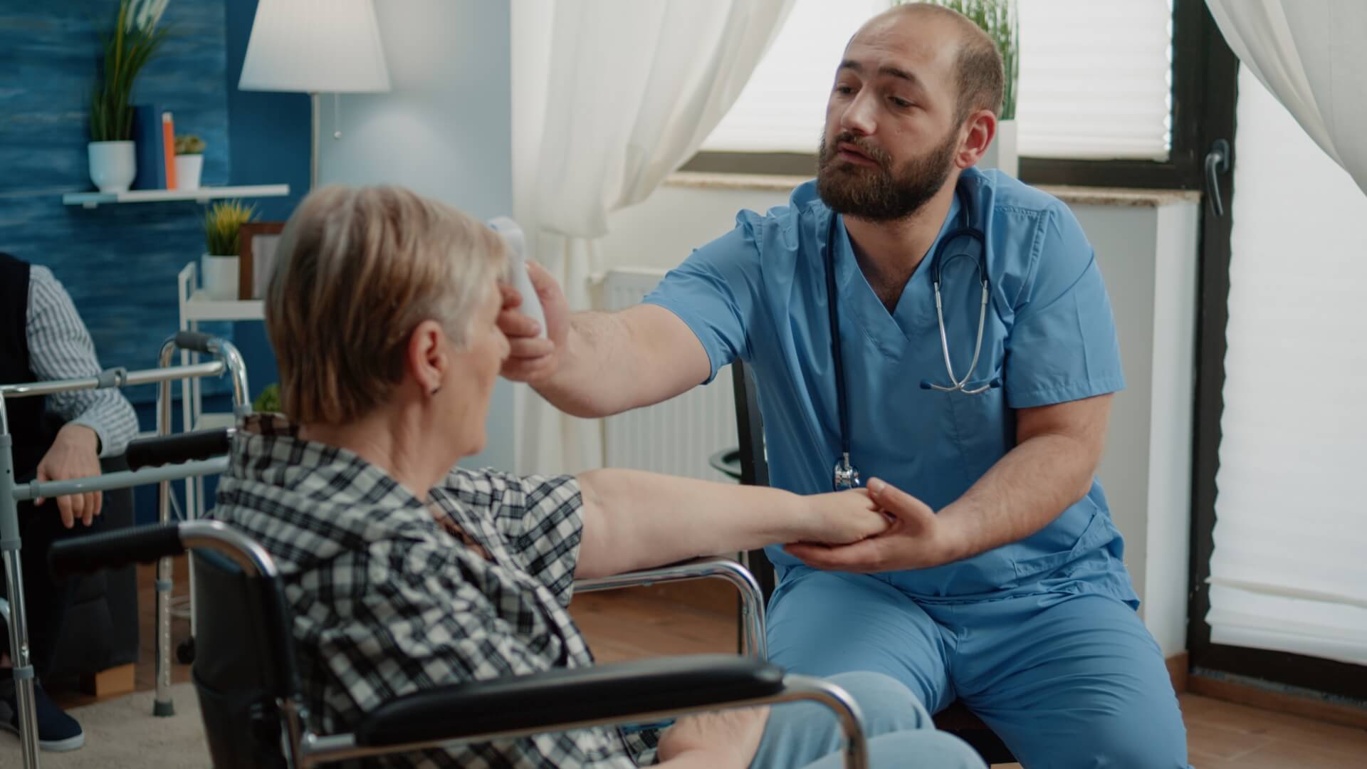Male nurse aiding patient in memory care with assisted living