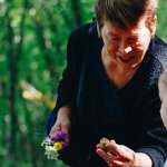 Grandmother with her granddaughter in nature.