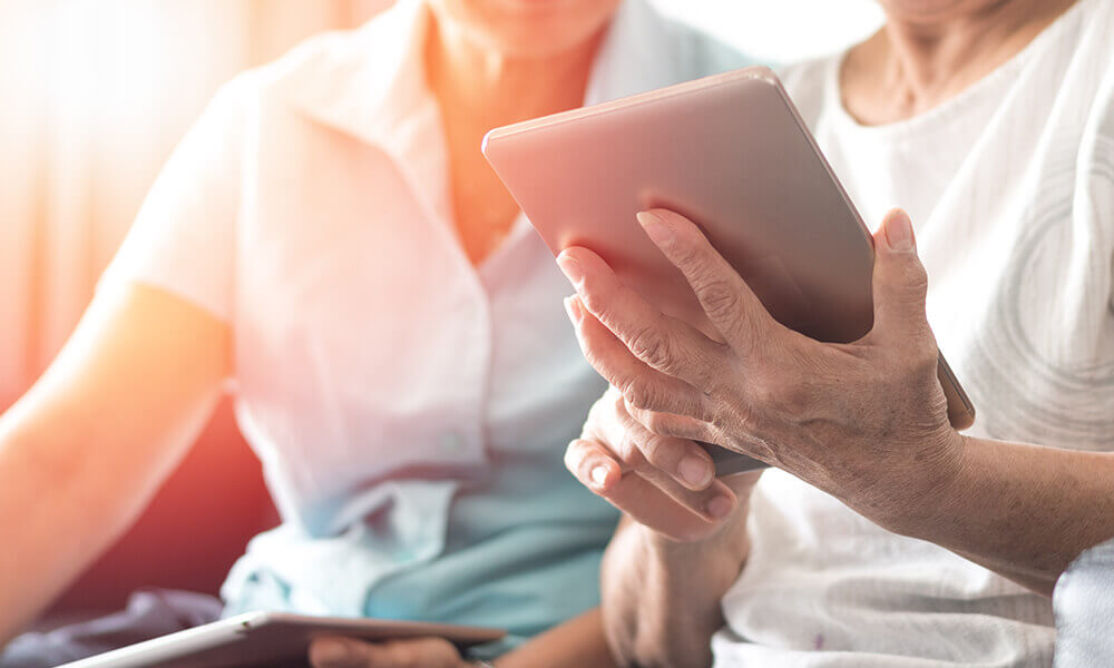 elderly people using tablet