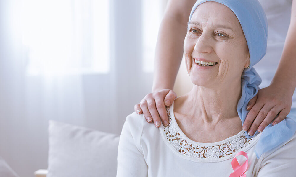 an elderly woman suffering from breast cancer