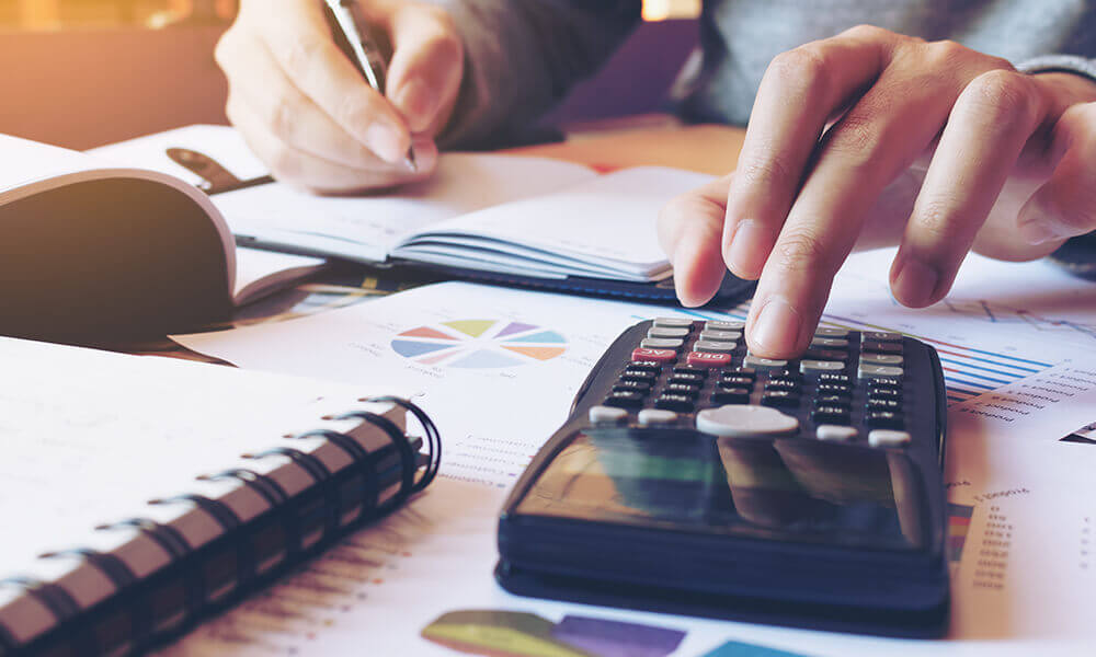 closeup of someone reviewing their finances at their desk
