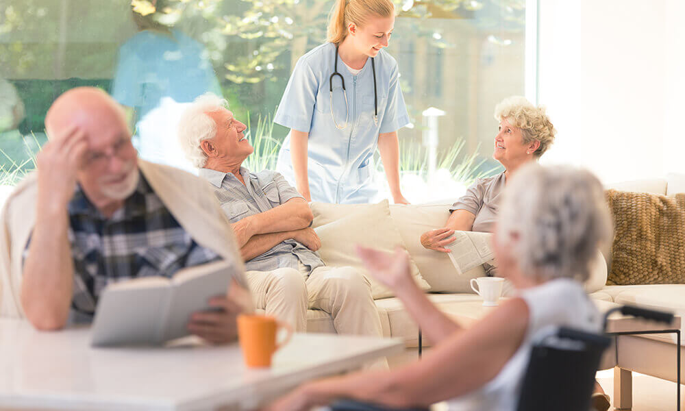 elderly people talking after getting a tour of an assisted living facility